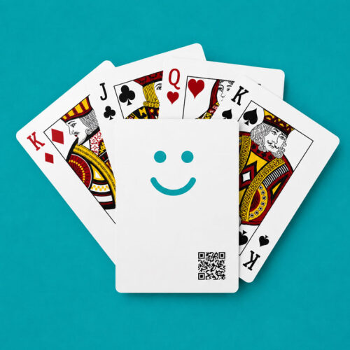 A white card deck with a blue smiley face; playing card qr