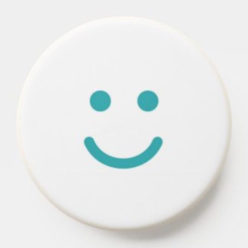 White phone grip with teal smiling face