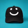 Black cap with white smile