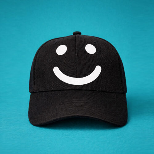 Black cap with white smile