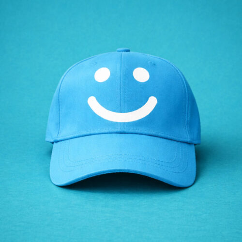 Blue cap with white smile