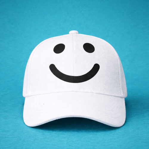 White cap with black smile