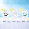 Three iced lemon water glasses with smiley faces