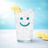 Iced glass with teal smile and lemon