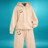 Beige tracksuit with black smile patches