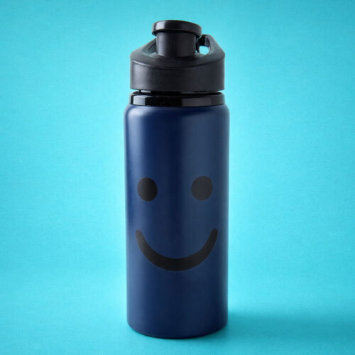 navy bottle with black smiley face
