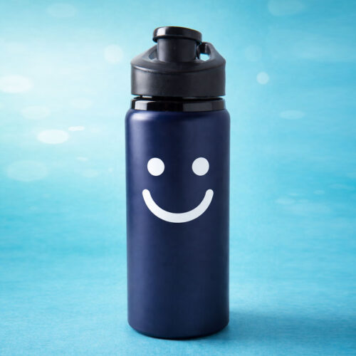 navy bottle with white smiley face