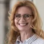 Smiling woman with glasses and blouse