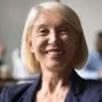 Elderly woman with short blonde hair